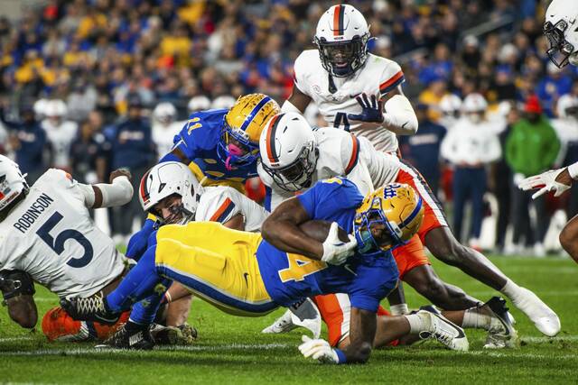 Pitt’s Daniel Carter carries the ball over the goal line for a touchdown against Virginia on Saturday, Nov. 9, 2024 at Acrisure Stadium.