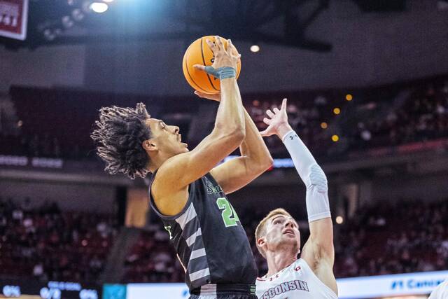 Duquesne transfer Jahsean Corbett shoots while playing for Chicago State against Wisconsin last season.