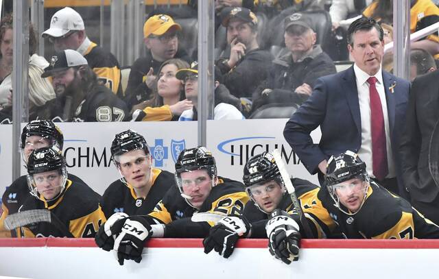 Penguins head coach Mike Sullivan on the bench at PPG Paints Arena.