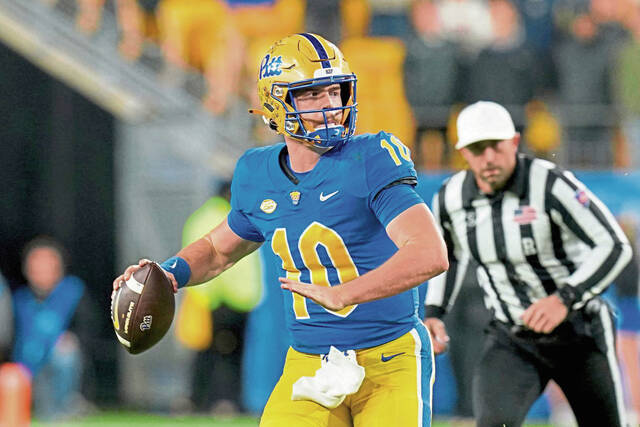 Pitt quarterback Eli Holstein (10) looks to throw during the first half of an NCAA college football game against Virginia Saturday, Nov. 9, 2024, in Pittsburgh.