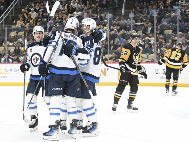 The Jets’ celebrate Gabriel Vilardi’s goal against the Penguins in the second period Friday.