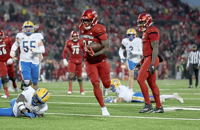 Louisville’s Isaac Brown runs for a touchdown against Pitt on Saturday.