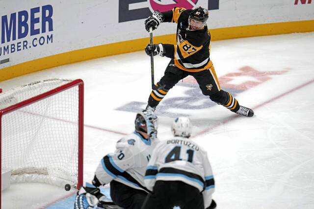 The Penguins’ Sidney Crosby scores past Utah goaltender Karel Vejmelka for his 600th career goal during the second period Saturday.