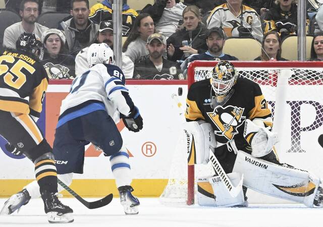 Penguins goaltender Tristan Jarry with a third-period save on the Jets’ Kyle Connor on Nov. 22, 2024 at PPG Paints Arena.