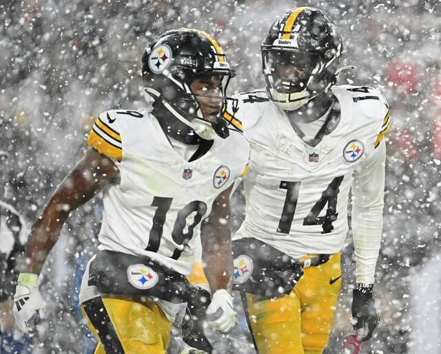 The Steelers’ George Pickens celebrates with Calvin Austin III against the Browns in the fourth quarter Nov. 21, 2024 at Huntington Bank Field.