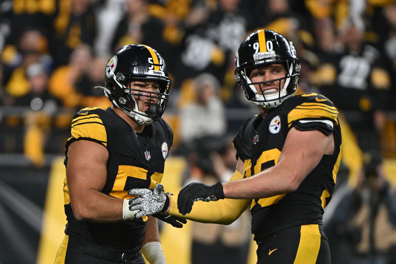 Pittsburgh Steelers outside linebackers T.J. Watt and Alex Highsmith celebrate after a sack on New York Giants quarterback Daniel Jones.