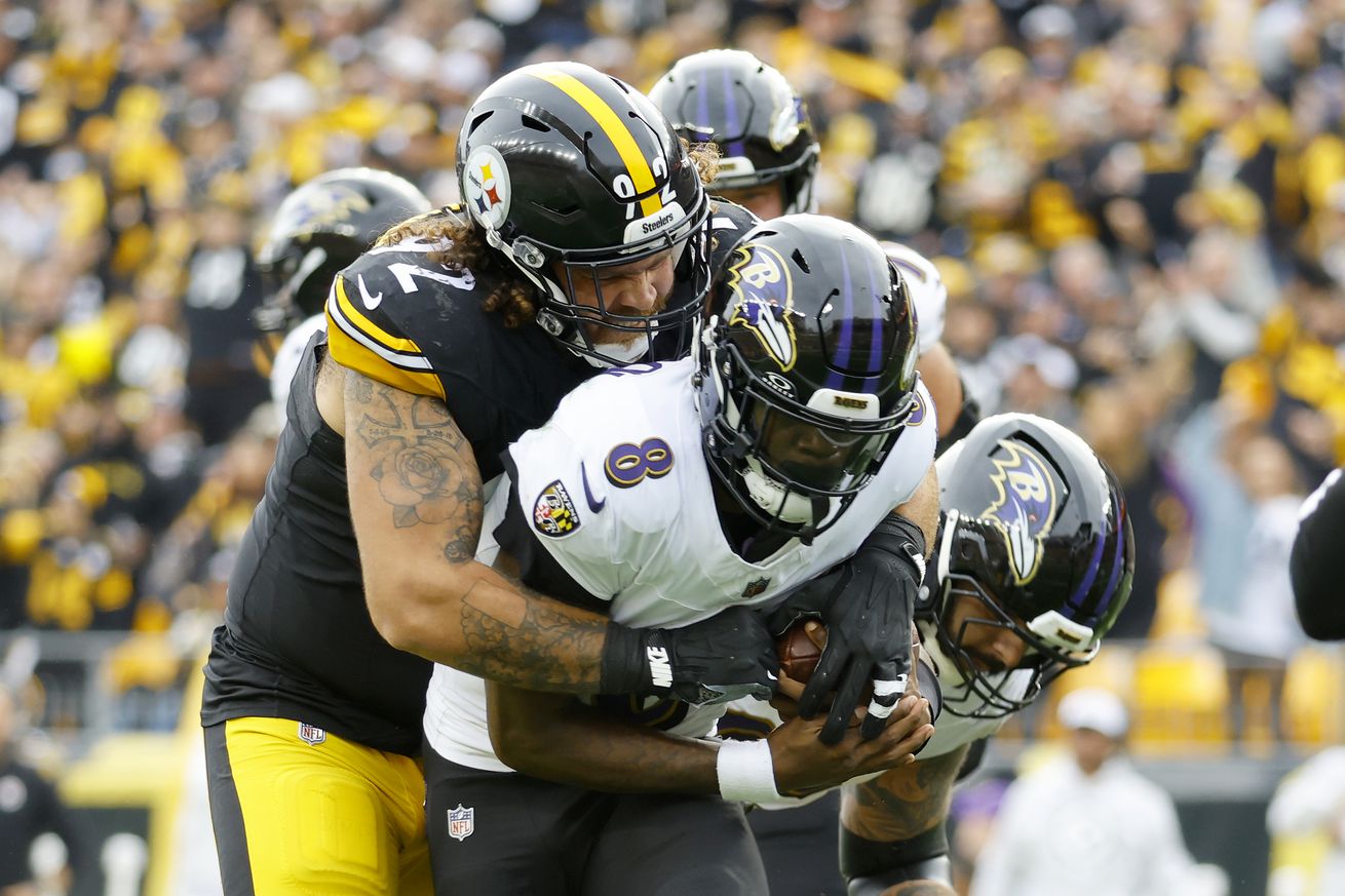 Pittsburgh Steelers defensive tackle Isaiahh Loudermilk gets to Baltimore Ravens quarterback Lamar Jackson during a 2024 regular season AFC North duel from Acrisure Stadium.