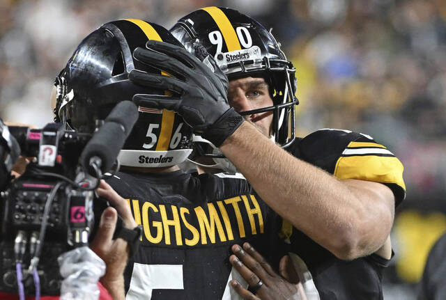 The Steelers’ T.J. Watt hugs Alex Highsmith after an pick-six on the first play of the game against the Browns on Sept. 18, 2023 at Acrisure Stadium.