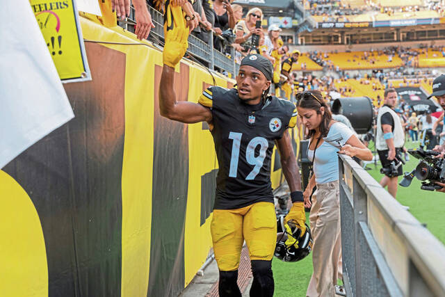 Pittsburgh Steelers wide receiver Calvin Austin III high fives fans after a September game at Acrisure Stadium. Austin will play Sunday at home against the Cleveland Browns after clearing NFL concussion protocol this week.