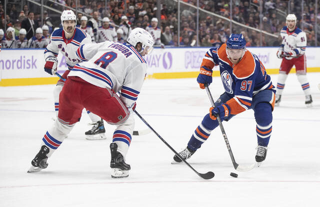 The Rangers’ Jacob Trouba defends against the Oilers’ Connor McDavid earlier this season.