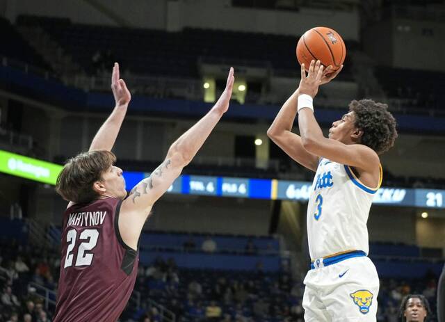 Pitt’s Brandin Cummings shoots over Eastern Kentucky’s Cyril Martynov on Wednesday, Dec. 11, 2024.