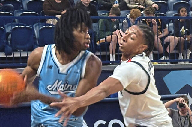 Duquesne’s Cam Crawford guards Maine’s A.J. Lopez on Wednesday, Dec. 11, 2024, at UPMC Cooper Fieldhouse.