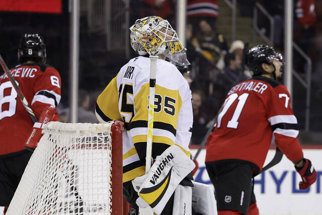 Penguins goaltender Tristan Jarry reacts after giving up a goal to Devils right wing Stefan Noesen during the second period Saturday.