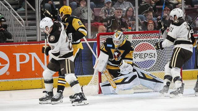 Wilkes-Barre/Scranton Penguins goaltender Filip Larsson defends his net while surrounded by Wilkes-Barre/Scranton Penguins forward Marc Johnstone and Hershey Bears forwards Ethen Frank (No. 28) and Spencer Smallman at the Giant Center in Hershey, Pa. on Dec. 22, 2024. The Penguins won, 1-0.
                                Wilkes-Barre/Scranton Penguins goaltender Filip Larsson defends his net while surrounded by Wilkes-Barre/Scranton Penguins forward Marc Johnstone and Hershey Bears forwards Ethen Frank (No. 28) and Spencer Smallman at the Giant Center in Hershey, Pa. on Sunday. The Penguins won, 1-0.