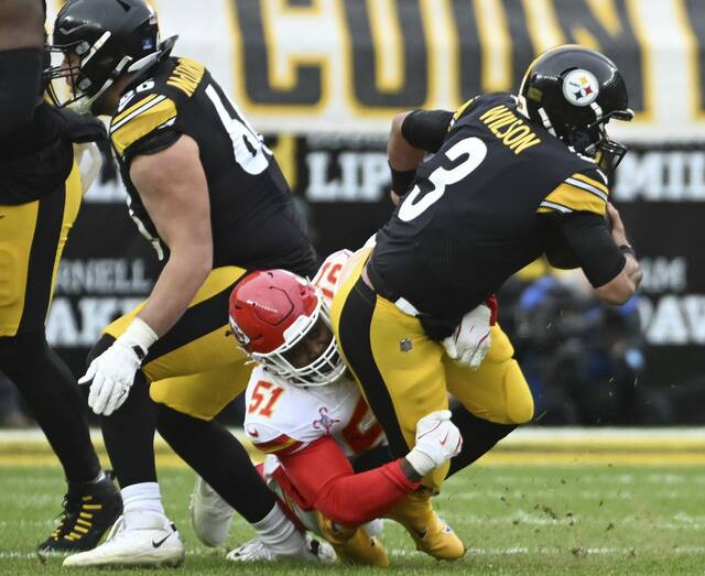 Steelers quarterback Russell Wilson gets sacked by the Chiefs’ Mike Danna in the third quarter Wednesday at Acrisure Stadium.