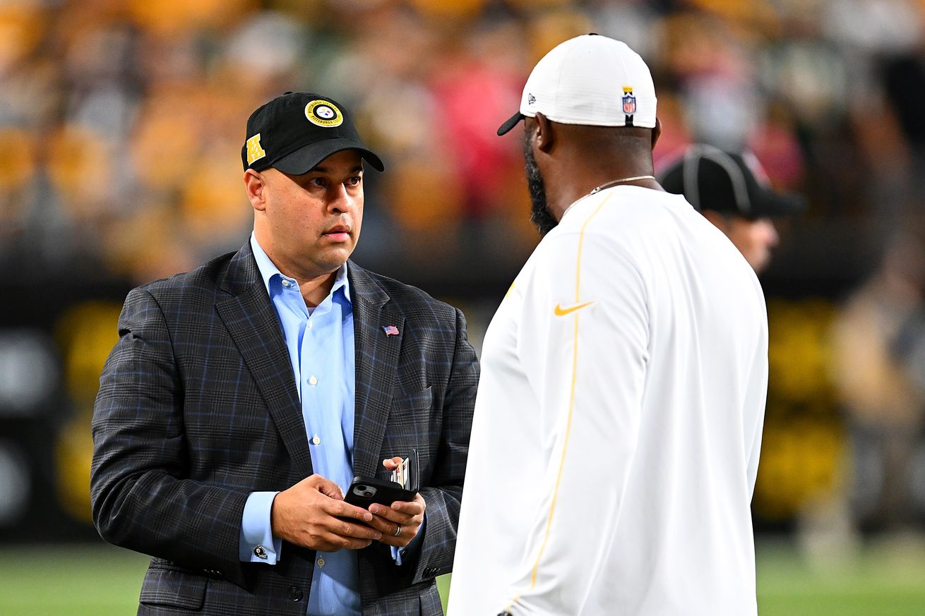 General manager Omar Khan of the Pittsburgh Steelers talks with head coach Mike Tomlin prior to the game against the New York Jets at Acrisure Stadium on October 20, 2024 in Pittsburgh, Pennsylvania.