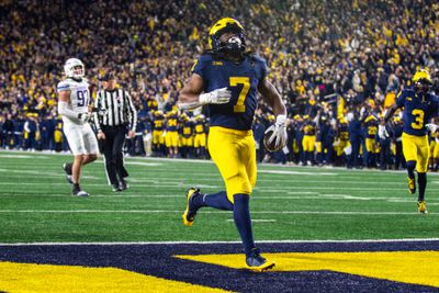 Michigan Wolverines running back Donovan Edwards celebrates a touchdown against the Northwestern Wildcats during an outing from Michigan Stadium.