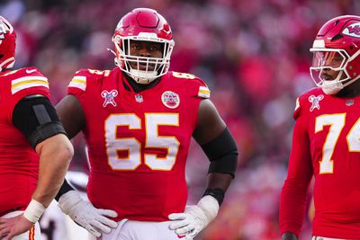 Trey Smith #65 of the Kansas City Chiefs looks on from the field during an NFL football game against the Houston Texans at GEHA Field at Arrowhead Stadium on December 21, 2024 in Kansas City, Missouri.