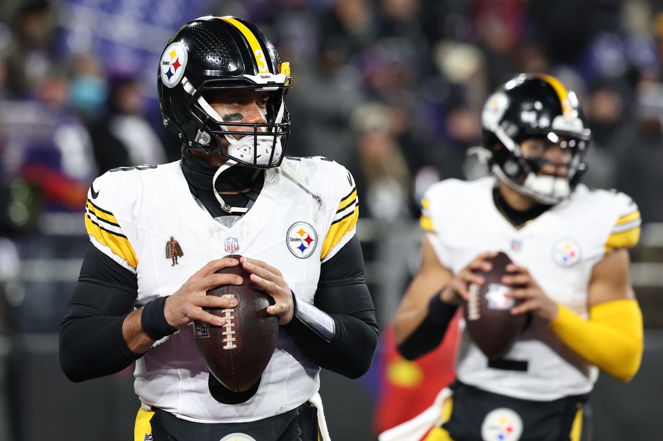 Russell Wilson #3 and Justin Fields #2 of the Pittsburgh Steelers warms up prior to the game against the Baltimore Ravens during the AFC Wild Card Playoff at M&T Bank Stadium on January 11, 2025 in Baltimore, Maryland.