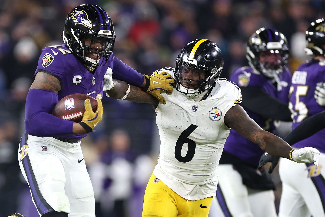 Derrick Henry #22 of the Baltimore Ravens runs the ball for a touchdown against Patrick Queen #6 of the Pittsburgh Steelers during the third quarter during the AFC Wild Card Playoff at M&T Bank Stadium on January 11, 2025 in Baltimore, Maryland.