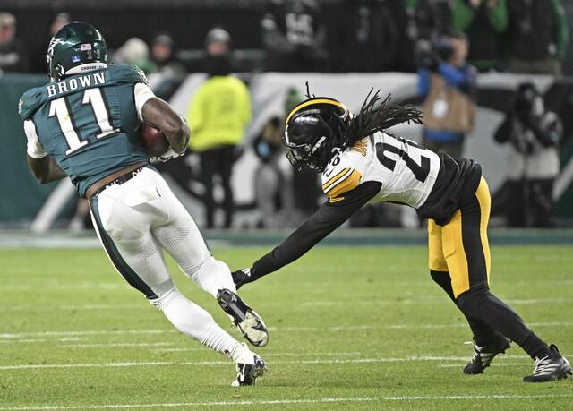 Pittsburgh Steelers cornerback Donte Jackson attempts to make a tackle on Philadelphia Eagles receiver A.J. Brown during a Dec. 15 game. Jackson suffered a back injury that day and is back on the injury report this week because of it.