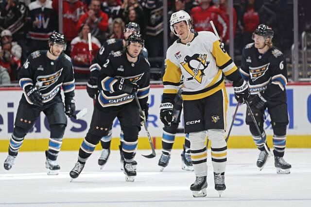 Penguins winger Rickard Rakell reacts after an empty-net goal by the Washington Capitals on Saturday at Capital One Arena.