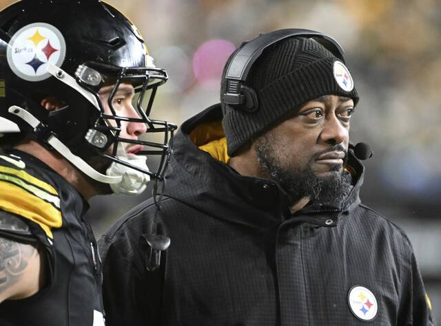 Pittsburgh Steelers coach Mike Tomlin looks on during Saturday’s loss to the Cincinnati Bengals at Acrisure Stadium. The Steelers now await to find out their seeding, opponent and time/date for the first round of the playoffs next weekend.