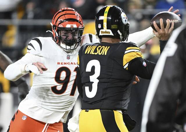 The Bengals’ Trey Hendrickson pressures Steelers quarterback Russell Wilson in the second quarter Saturday, Jan. 4, 2025 at Acrisure Stadium.