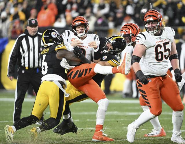 The Steelers’ Alex Highsmith strip sacks Bengals quarterback Joe Burrow in the second quarter Saturday Jan. 4, 2025 at Acrisure Stadium.