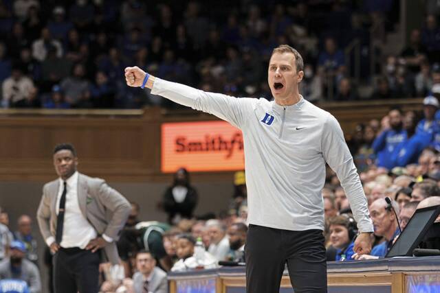 Duke coach Jon Scheyer gestures to his team during the second half against George Mason earlier this season.