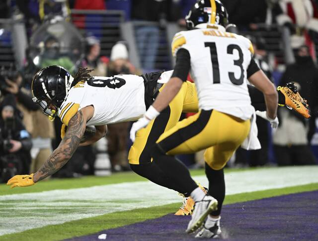 The Steelers’. MyCole Pruitt pulls in a second-quarter touchdown Saturday Dec. 21, 2024 at M&T Bank Stadium.