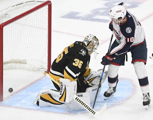 The Blue Jackets’ Dmitri Voronkov beats Penguins goaltender Tristan Jarry on the Blue Jackets first shot of the game Tuesday at PPG Paints Arena.