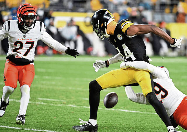 The Bengals’ Cam Taylor-Britt defends on a pass intended for the Steelers’ George Pickens in the fourth quarter Saturday at Acrisure Stadium.