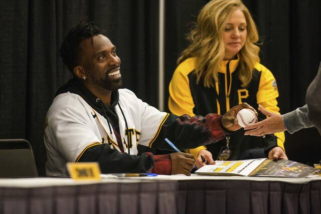 The Pittsburgh Pirates’ Andrew McCutchen signs fan autographs during PiratesFest on Jan. 6, 2024 in Pittsburgh.