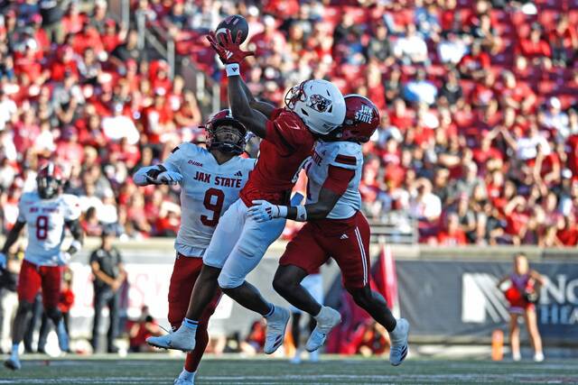 Louisville wide receiver Cataurus Hicks (81) makes a catch over the defense of Jacksonville State cornerback Geimere Latimer (1) in Louisville, Ky., on Sept. 7, 2024.