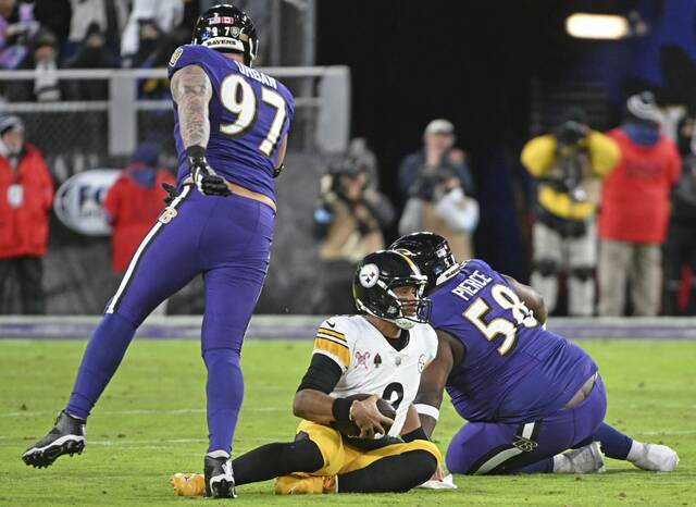 Steelers quarterback Russell Wilson is sacked by the Ravens’ Michael Pierce in their Dec. 21 game at M&T Bank Stadium.