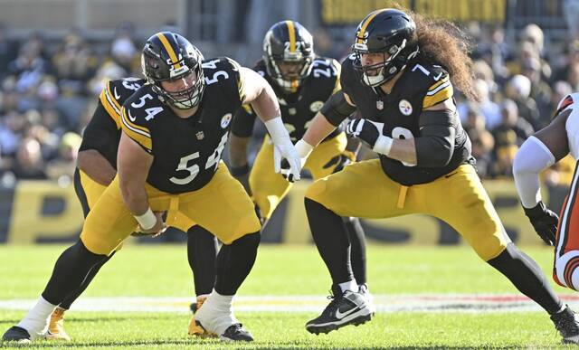 Steelers center Zach Frazier snaps the ball as offensive guard Isaac Seumalo pulls against the Cleveland Browns on Sunday, Dec. 8, 2024, at Acrisure Stadium.