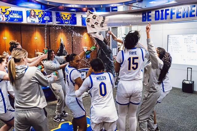 Pitt women’s basketball players celebrate their NCAA-record comeback victory over SMU on Sunday.