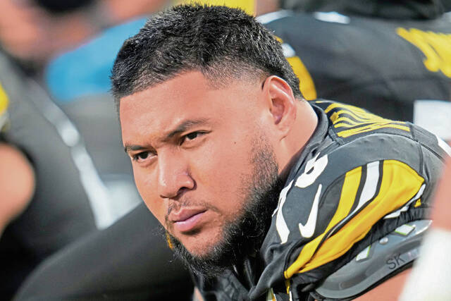 Shown while sitting on the bench during a preseason game, Pittsburgh Steelers offensive tackle Troy Fautanu missed most of his rookie season because of injury after being a first-round pick.