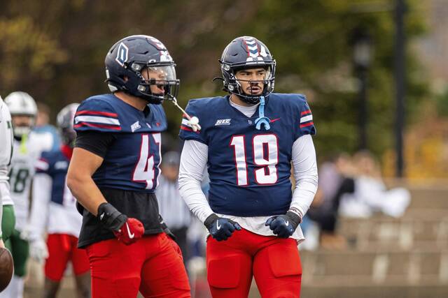 Brothers Adrian (47) and Carlos Ramirez (19), both members of the Duquesne football team, compete during the 2024 football season.