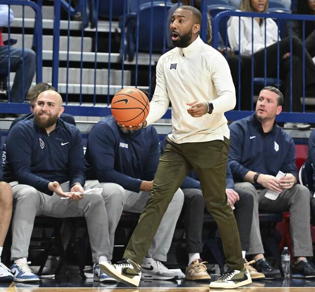 Duquesne coach Dru Joyce III instructs his team against St. Joseph’s in the second half Wednesday.