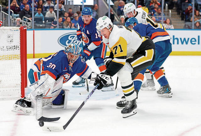 Islanders goaltender Ilya Sorokin defends against Penguins center Evgeni Malkin during the first period Dec. 28.