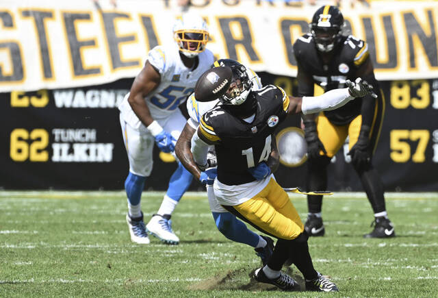 Steelers receiver George Pickens can’t hang on to the ball against the Los Angeles Chargers in their Sept. 22 game at Acrisure Stadium.