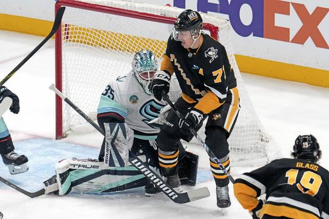 Penguins center Evgeni Malkin screens Seattle Kraken goaltender Joey Daccord during the first period Tuesday.