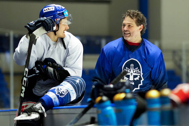 Jaromir Jagr, right, talks to his teammates during a practice session of his team Kladno Knights in Kladno, Czech Republic, Thursday, Feb. 8, 2024.