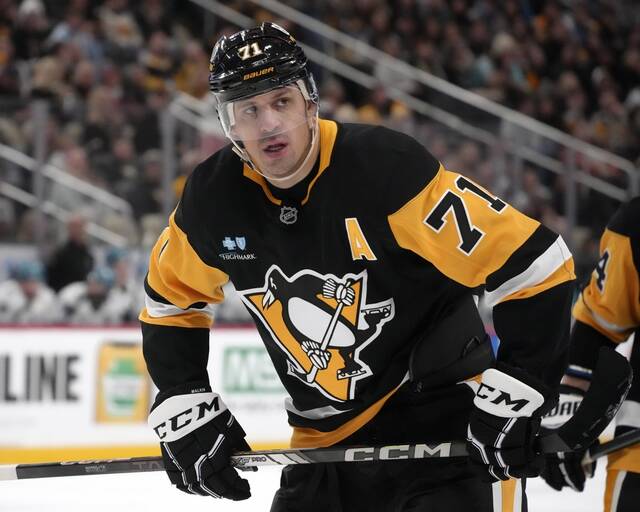 Pittsburgh Penguins’ Evgeni Malkin prepares to take a face-off during the second period against the San Jose Sharks in Pittsburgh.