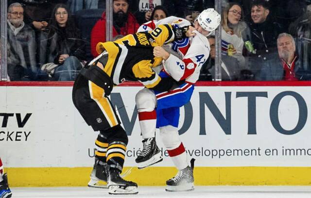 Wilkes-Barre/Scranton Penguins defenseman Dan Renouf fights Laval Rocket forward Lucas Condotta during a game at Place Bell in Laval, Quebec on Wednesday. The Rocket won, 4-3, in overtime.