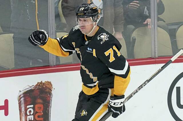 Pittsburgh Penguins’ Evgeni Malkin celebrates after scoring during the first period of a game against the Florida Panthers in Pittsburgh.