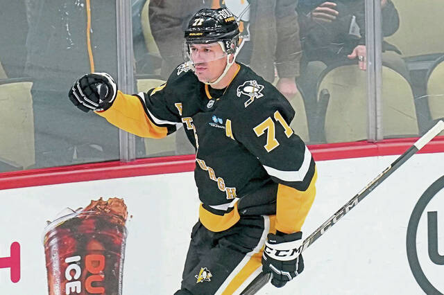 Pittsburgh Penguins’ Evgeni Malkin celebrates after scoring during the first period of a game against the Florida Panthers in Pittsburgh.