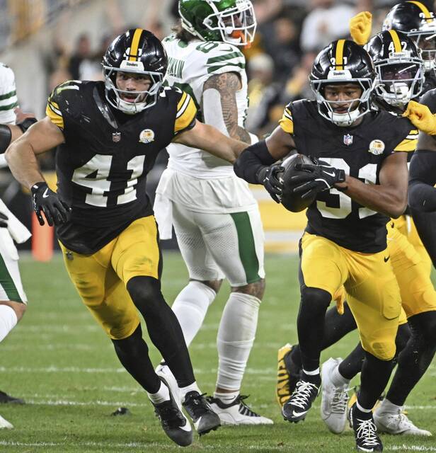 Steelers Payton Wilson celebrates with Beanie Bishop after a second-quarter interception of the Jets’ Aaron Rodgers on Oct. 20, 2024 at Acrisure Stadium.